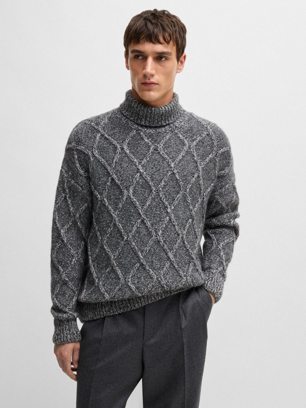 RELAXED-FIT CABLE KNIT SWEATER