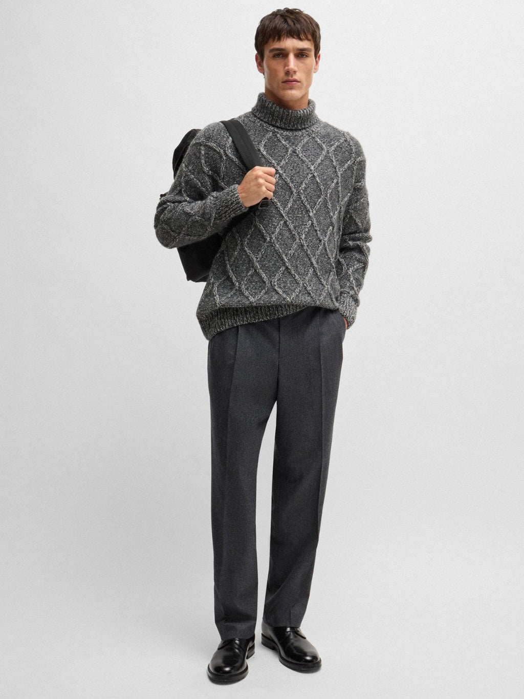 RELAXED-FIT CABLE KNIT SWEATER